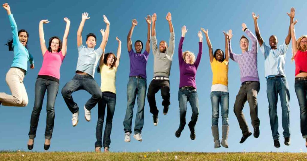 people smiling and jumping